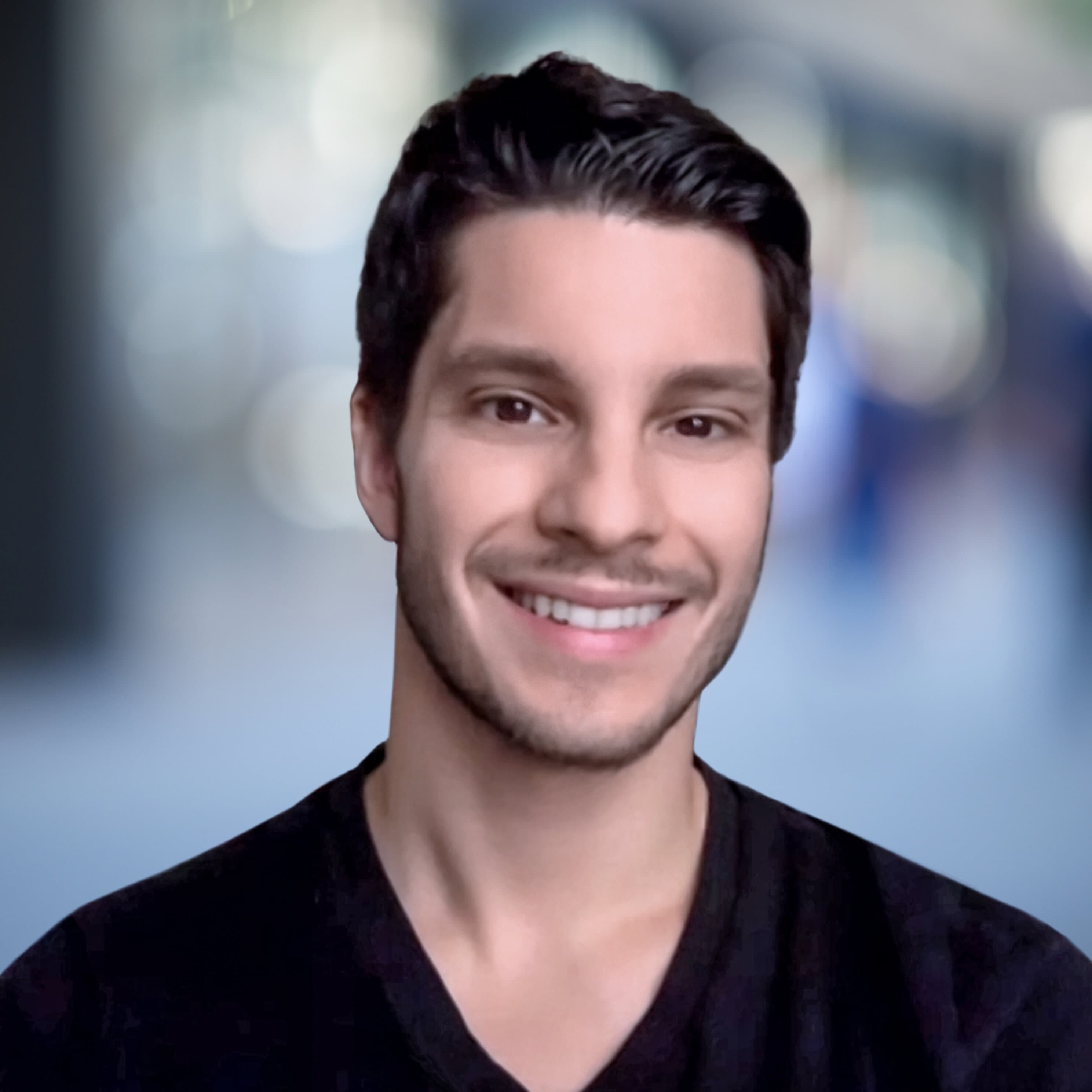 A headshot of Travis